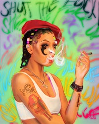 a woman with tattoos and a hat smoking a cigarette
